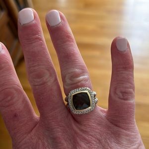 David yurman stone ring set in gold with silver band.